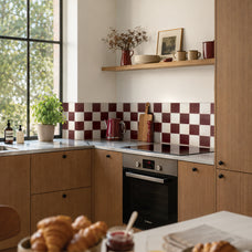 White and red checkerboard peel and stick backsplash tile by Smart Tiles in a kitchen